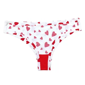 Close-up of white seamless panties with red heart print and reinforced red crotch
