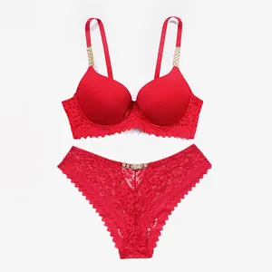 Elegant red lace lingerie set featuring sparkling rhinestone chain straps and push-up bra design