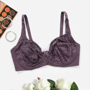 Detail view of a sexy purple lace underwire bra featuring intricate floral patterns.