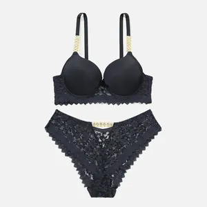 Sexy black lace lingerie set featuring sparkling rhinestone chain straps and push-up bra