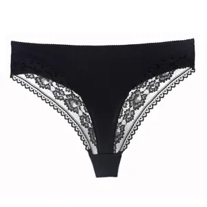 Elegant black cotton thong for women featuring intricate lace trim and breathable fabric.