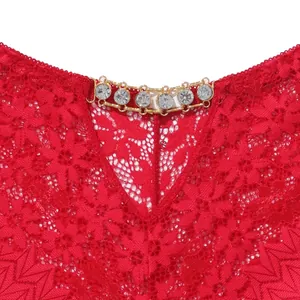 Close-up detail of sexy red floral lace lingerie with sparkling rhinestone metal chain