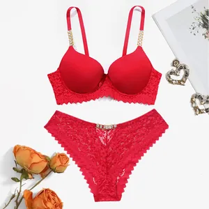 Detail view of red lace lingerie set with elegant rhinestone metal chain straps