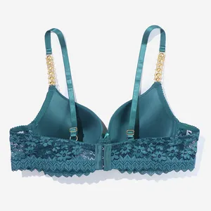Detailed back view of emerald green lace bra with gold chain straps and adjustable closure