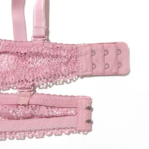 Close-up view of pink floral lace bra back strap with adjustable hook and eye closure.