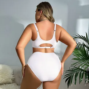 Back view of plus-size white seamless wireless bra and high-waisted panty set for women