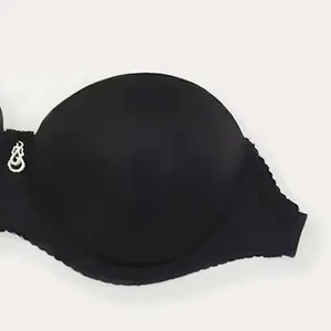Close-up detail of black strapless invisible bra cup with seamless side wing and decor