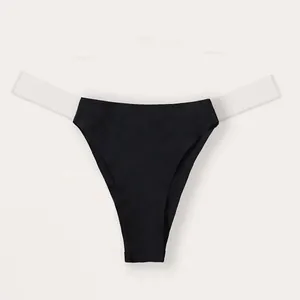 Seamless black thong featuring transparent invisible side straps for a minimalist look.