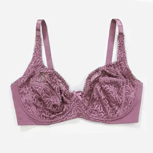 Detailed close-up showing the intricate floral lace and center bow on the mauve bra