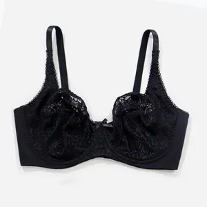 Detailed close-up view of the black floral lace and center bow on the underwire bra
