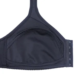 Detail of black wireless bra showing inner cup lining and side hook-and-eye closure