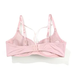 Detail view of pink push-up bra featuring massage texture interior and adjustable straps.