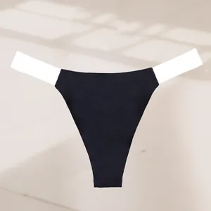 Macro view of sexy seamless high cut thong featuring black fabric and white elastic waistbands