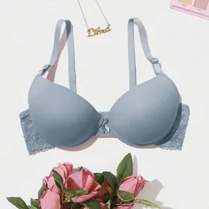 Minimalist light blue push-up lace bra with smooth cups and floral background decor