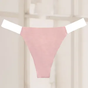 Close-up detail of a sexy pink seamless thong with transparent elastic side straps