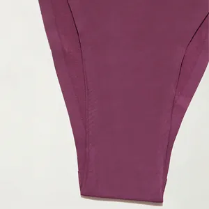 Close-up detail of purple seamless T-back thong underwear showing the smooth fabric texture