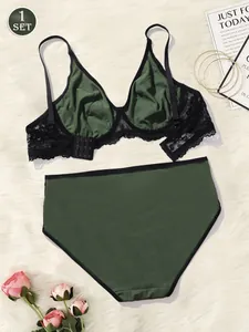 Elegant dark green plus size lingerie set with black lace detailing and underwire