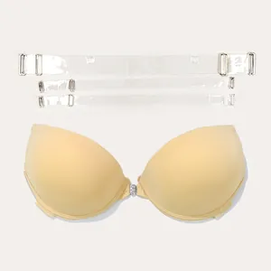 Macro view of beige front-close invisible bra set featuring clear transparent straps