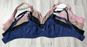 Stacked full coverage bras in multiple colors with delicate lace print and bow details.