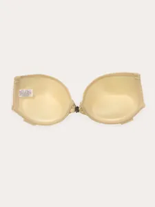 Detailed interior view of a nude strapless invisible bra with front buckle and care label