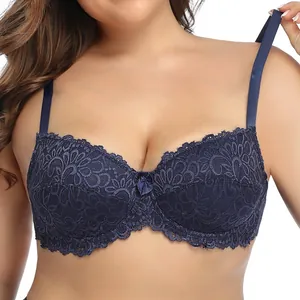 Detailed close-up of navy blue lace full cup bra with floral patterns and bow detail.