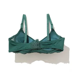 Detailed view of dark green lace bra back with double row hook-and-eye closure