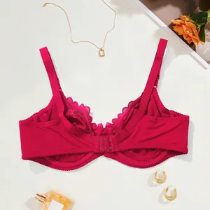 Rear view of a red lace bra with double hook-and-eye closure and scalloped edges