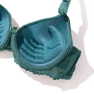 Detail view of green push-up bra inner cup with palm-shaped thick padding design