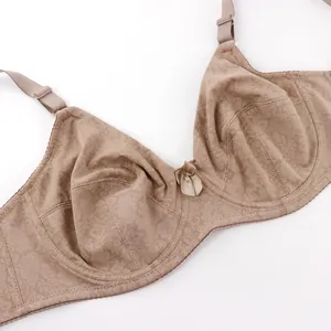 Detailed macro view of a floral print minimizer bra with a delicate bow accent