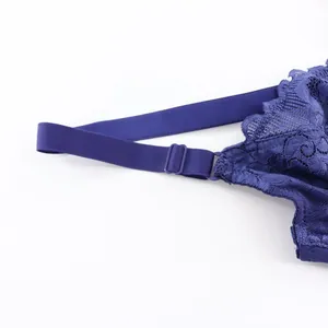 Detailed view of the adjustable shoulder strap and blue lace edge of women's bra