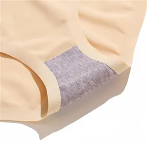 Detail view of seamless beige briefs with a high-quality grey cotton lining for daily comfort.
