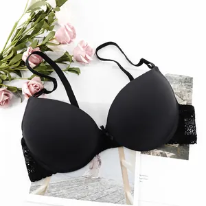 Elegant black lace bra with decorative bow and underwire on a stylish floral background