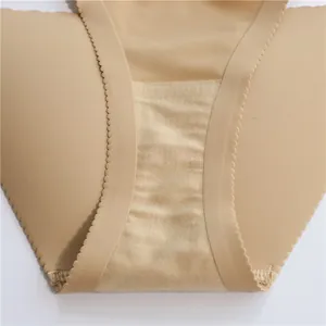 Close-up of seamless beige butt-lifting bikini thong with scalloped edges and breathable crotch