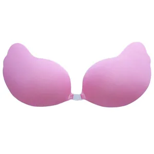 Pink wing-shaped adhesive silicone bra with a clear front buckle for invisible support