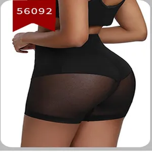Close-up detail of black high-waisted tummy control shorts with mesh butt lift panel