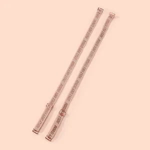 Detail view of 1.2cm elastic bra straps with steel buckles and jacquard letter pattern