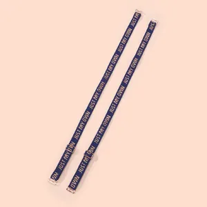 Close-up of 1.2cm blue elastic bra straps with 'JUST MY OWN' jacquard and rose gold buckles
