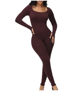Front view of a brown long-sleeve slimming bodysuit shapewear on a model