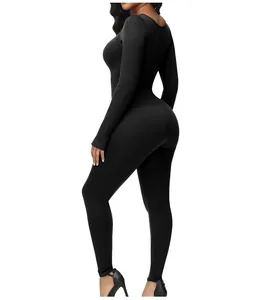Detailed view of black long-sleeved full-body shapewear bodysuit with tummy control and lifting