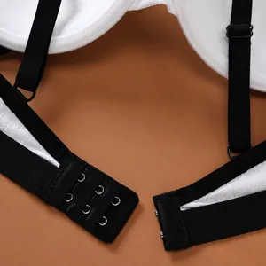Close-up of black lace push-up bra showing adjustable straps and back hooks.