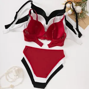Sexy Spitzen-Lingerie-Set mit BH und Slip für Damen in Rot, Weiß und Schwarz.