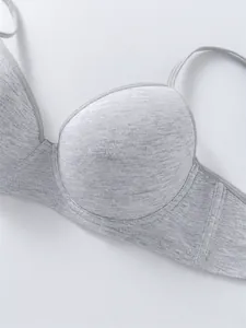 Detail view of light gray cotton bra featuring breathable fabric and underwire