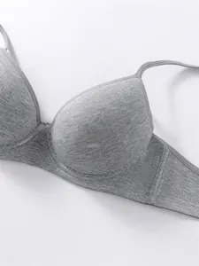 Close-up of breathable gray cotton fabric on a supportive push-up bra for girls
