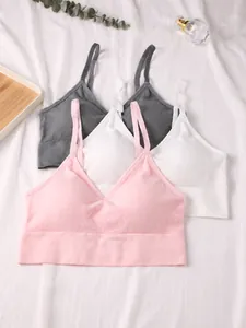 Selection of seamless ribbed bralettes in pink, white, and grey colors