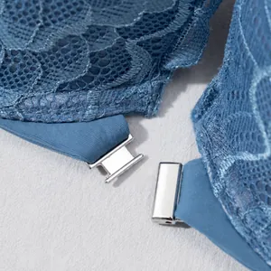 Detailed view of a sexy blue French lace bra featuring a secure silver metal front closure