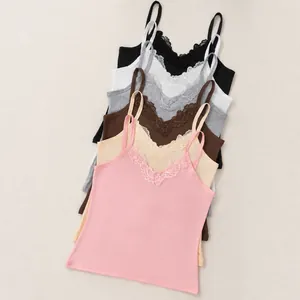 Detail view of slim-fit V-neck camisoles with delicate lace trim in multiple colors
