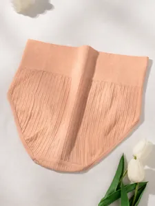 Close-up of peach ribbed high waist tummy control panties with seamless elastic band