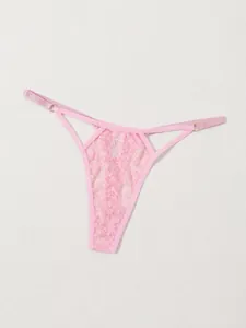 Close-up detail of pink floral lace thong with elegant hollow-out design and straps