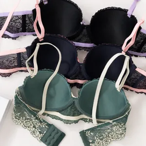 Collection of three sexy lace bras in black, navy blue, and green colors for women
