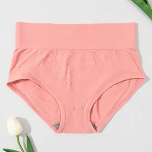 Detailed close-up view of pink high-waist tummy control panties with honeycomb texture fabric